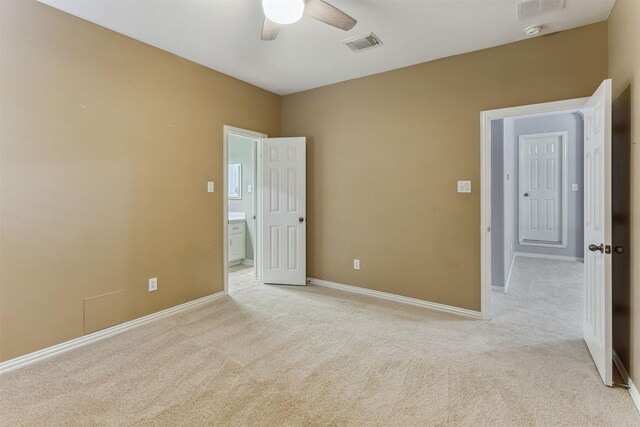 7014 Lake Haven Ct, Sugar Land, TX 77479 - unfurnished bedroom with light carpet, baseboards, and ceiling fan