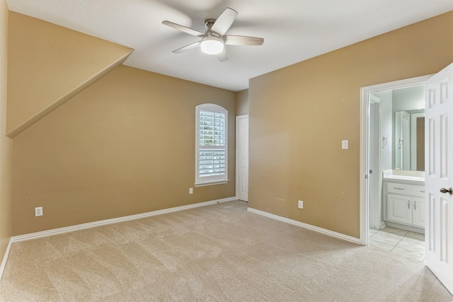 7014 Lake Haven Ct, Sugar Land, TX 77479 - spare room with light colored carpet, ceiling fan, and baseboards