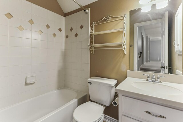 7014 Lake Haven Ct, Sugar Land, TX 77479 - full bathroom with toilet, shower / washtub combination, vanity, and vaulted ceiling