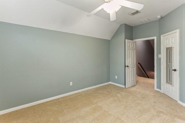 7014 Lake Haven Ct, Sugar Land, TX 77479 - unfurnished bedroom featuring light carpet, baseboards, lofted ceiling, and a ceiling fan