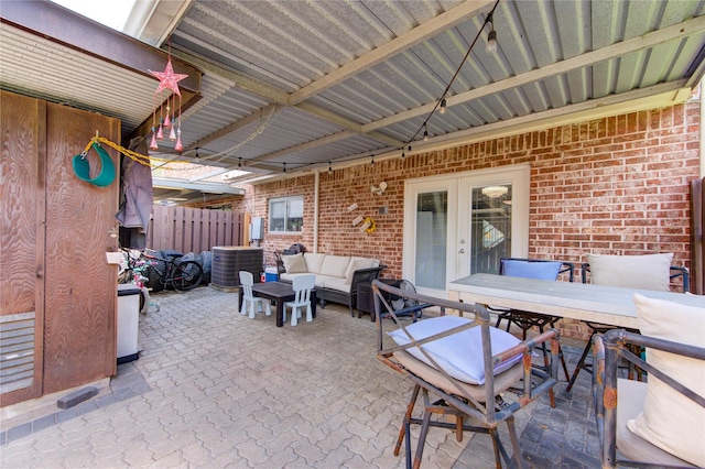 2246 Triway Ln, Houston, TX 77043 - view of patio / terrace with outdoor lounge area, french doors, central AC unit, and outdoor dining area