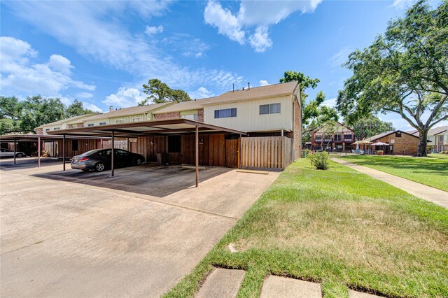 2246 Triway Ln, Houston, TX 77043 - view of property featuring covered parking and a front yard