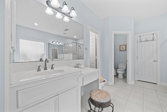 8910 Cote Ct, Houston, TX 77064 - full bath featuring a stall shower, vanity, tile patterned floors, toilet, and baseboards
