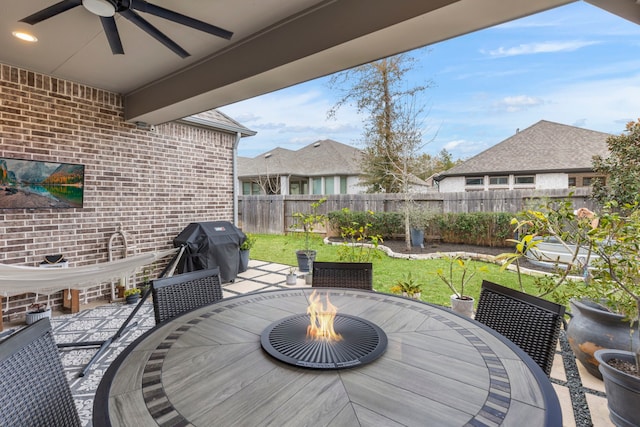 17185 Foxtrot Way, Conroe, TX 77302 - view of patio / terrace with a ceiling fan, area for grilling, outdoor dining area, and an outdoor fire pit