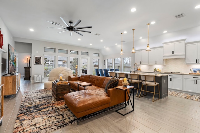 17185 Foxtrot Way, Conroe, TX 77302 - living room featuring ceiling fan, light wood-style floors, and recessed lighting