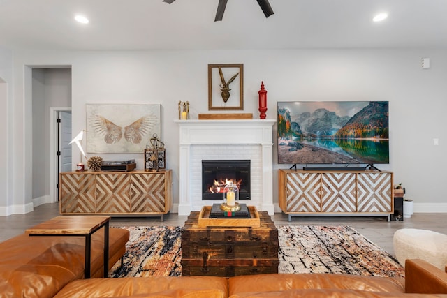 17185 Foxtrot Way, Conroe, TX 77302 - living area featuring a ceiling fan, recessed lighting, baseboards, a brick fireplace, and wood finished floors