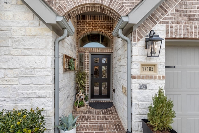 17185 Foxtrot Way, Conroe, TX 77302 - doorway to property featuring stone siding, french doors, and brick siding