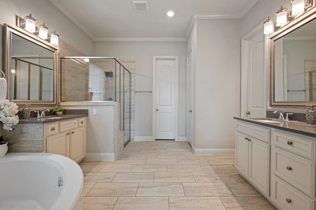 18735 Evanhale Bend Dr, Cypress, TX 77429 - full bath with two vanities, a shower stall, crown molding, a bath, and recessed lighting