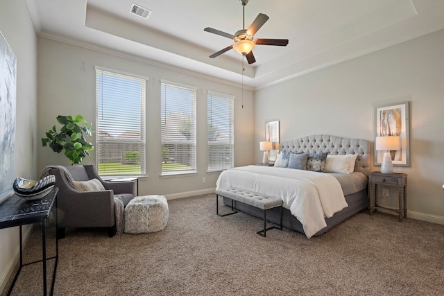 18735 Evanhale Bend Dr, Cypress, TX 77429 - carpeted bedroom featuring a raised ceiling, multiple windows, ornamental molding, baseboards, and a ceiling fan