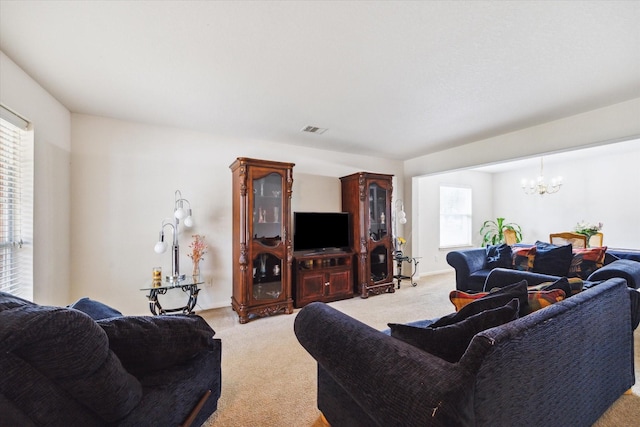 20203 Stonegrove Ct, Tomball, TX 77375 - living room with a chandelier and light colored carpet