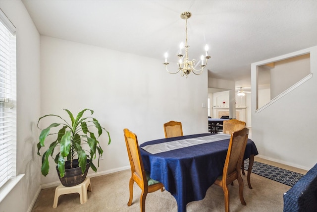 20203 Stonegrove Ct, Tomball, TX 77375 - dining area featuring carpet flooring, a chandelier, and plenty of natural light