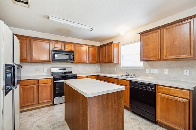 20203 Stonegrove Ct, Tomball, TX 77375 - kitchen featuring black appliances, a sink, light countertops, decorative backsplash, and brown cabinets