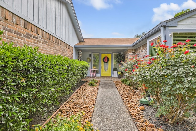 12121 Maverick Dr, Willis, TX 77378 - entrance to property featuring brick siding and board and batten siding
