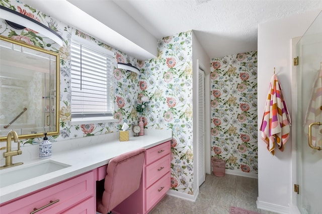 12121 Maverick Dr, Willis, TX 77378 - bathroom featuring wallpapered walls, vanity, baseboards, a shower, and a textured ceiling