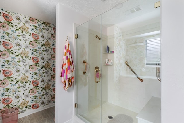 12121 Maverick Dr, Willis, TX 77378 - full bath with a shower stall, baseboards, wallpapered walls, and wood finished floors