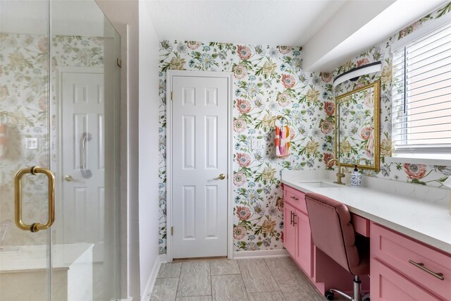 12121 Maverick Dr, Willis, TX 77378 - full bath with wallpapered walls, baseboards, vanity, and a shower stall