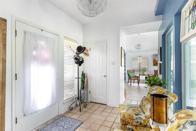 12121 Maverick Dr, Willis, TX 77378 - entrance foyer with light tile patterned floors