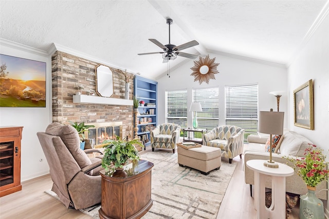 12121 Maverick Dr, Willis, TX 77378 - living room with light wood-style floors, a ceiling fan, a brick fireplace, and a textured ceiling