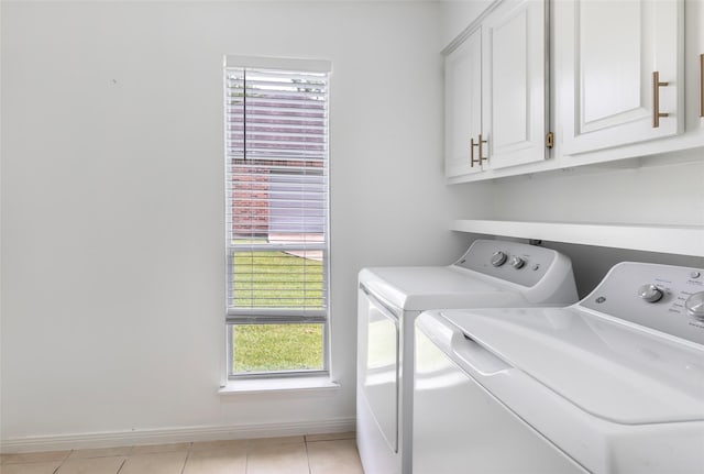 12121 Maverick Dr, Willis, TX 77378 - washroom with separate washer and dryer, cabinet space, healthy amount of natural light, and light tile patterned floors