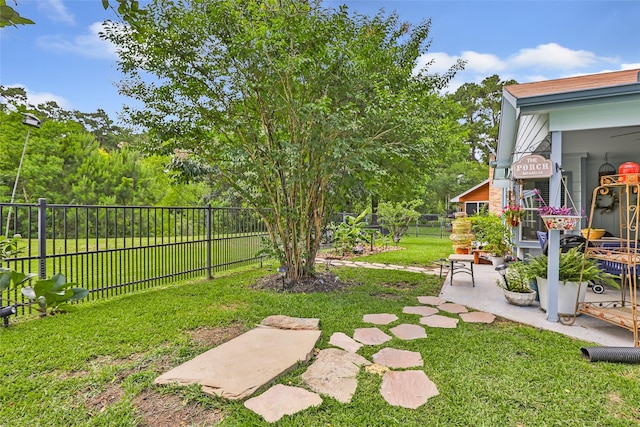 12121 Maverick Dr, Willis, TX 77378 - view of yard with a patio area