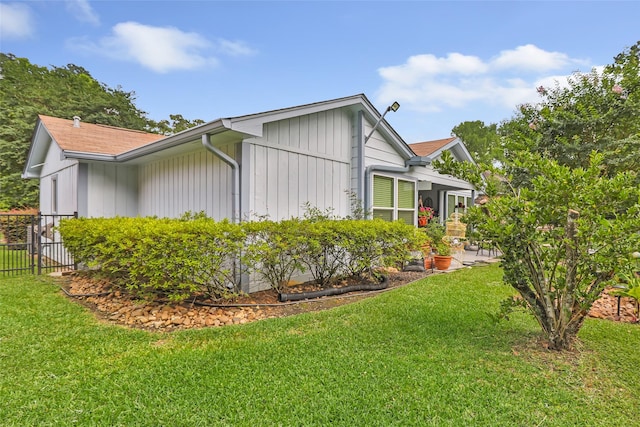 12121 Maverick Dr, Willis, TX 77378 - view of home's exterior with board and batten siding