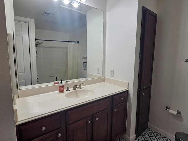 7575 Kirby Dr Unit 1104, Houston, TX 77030 - bathroom featuring vanity, a shower with shower curtain, and baseboards
