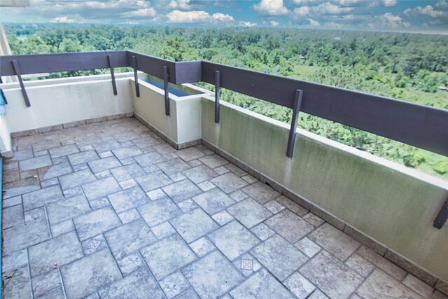 14655 Champion Forest Dr Unit 1102, Houston, TX 77069 - balcony featuring a forest view