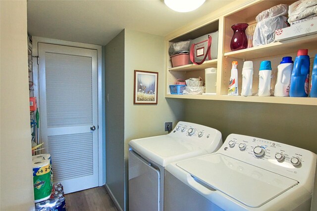 14655 Champion Forest Dr Unit 1102, Houston, TX 77069 - laundry room with washing machine and dryer and dark wood finished floors