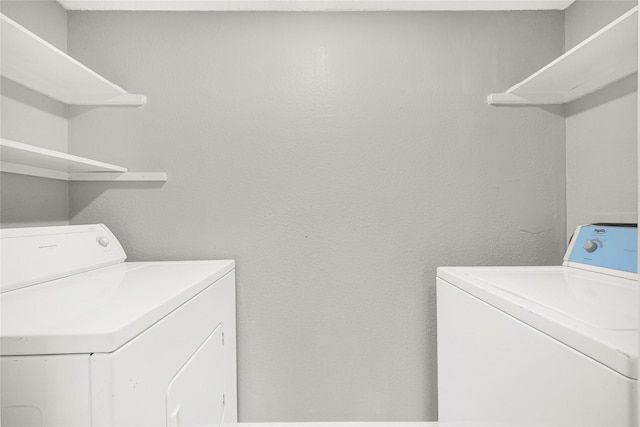 8385 Sands Point Dr Unit 5, Houston, TX 77036 - laundry room featuring washer and clothes dryer