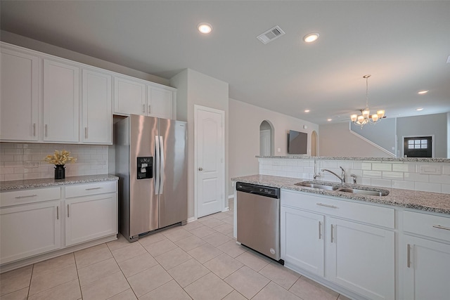 31630 Heguy Pass, Fulshear, TX 77441 - kitchen featuring stainless steel appliances, a sink, backsplash, white cabinets, and recessed lighting