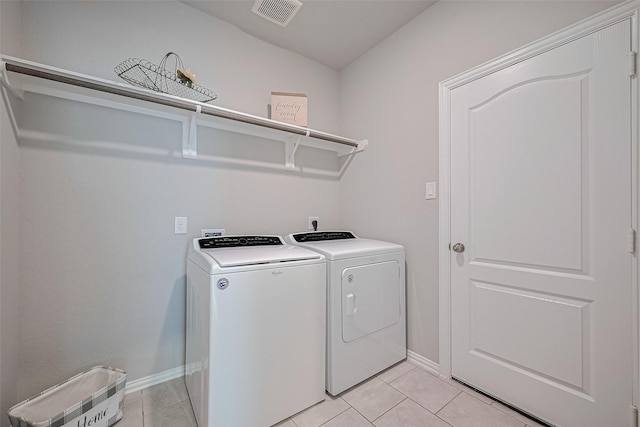 31630 Heguy Pass, Fulshear, TX 77441 - laundry area with independent washer and dryer, light tile patterned flooring, and baseboards