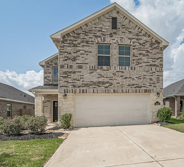 31630 Heguy Pass, Fulshear, TX 77441 - view of front facade with driveway, an attached garage, brick siding, and stone siding