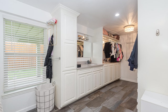 6840 County Road 659, Brazoria, TX 77422 - full bath featuring baseboards, vanity, a spacious closet, healthy amount of natural light, and recessed lighting
