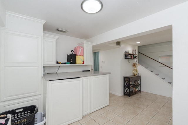 6840 County Road 659, Brazoria, TX 77422 - bar featuring light tile patterned flooring and stairway