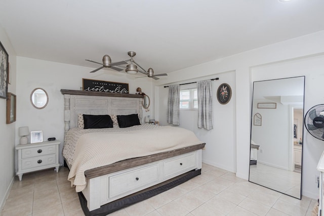 6840 County Road 659, Brazoria, TX 77422 - bedroom with light tile patterned floors, ceiling fan, and baseboards