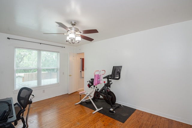 6840 County Road 659, Brazoria, TX 77422 - workout room featuring ceiling fan, baseboards, and light wood-type flooring