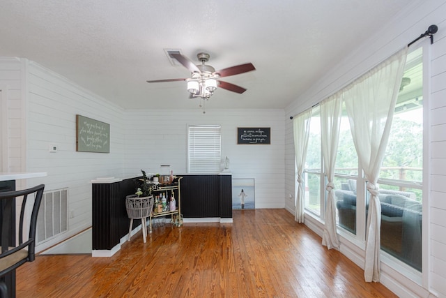 6840 County Road 659, Brazoria, TX 77422 - office space featuring wood finished floors, ceiling fan, and wooden walls