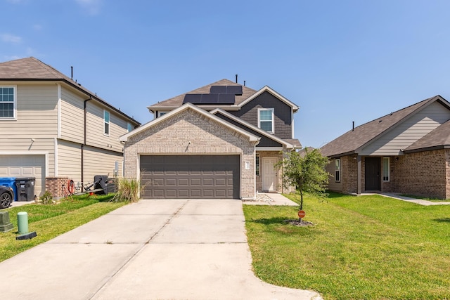 25131 Bells Canyon Dr, Porter, TX 77365 - view of front of property with brick siding, a front yard, concrete driveway, solar panels, and a garage