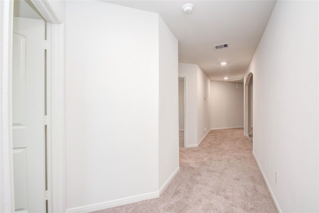 10699 Lost Maples Dr, Cleveland, TX 77328 - hall featuring light colored carpet, baseboards, and recessed lighting
