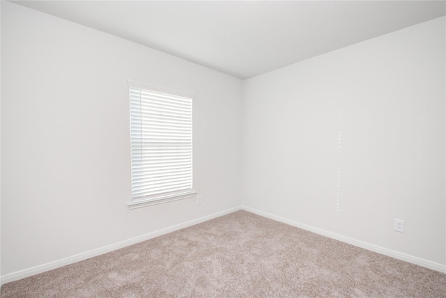 10699 Lost Maples Dr, Cleveland, TX 77328 - empty room featuring baseboards and carpet flooring