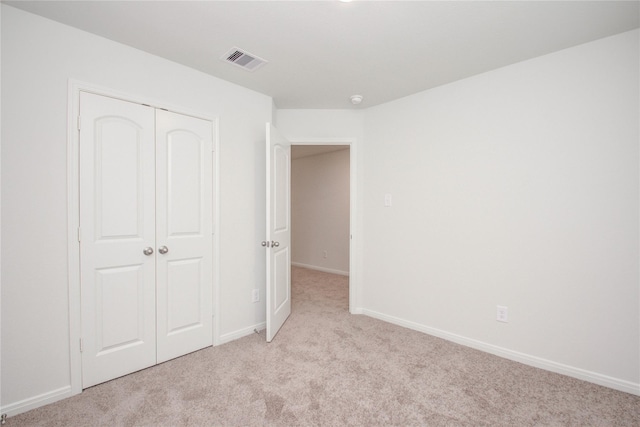 10699 Lost Maples Dr, Cleveland, TX 77328 - unfurnished bedroom with light carpet, a closet, and baseboards