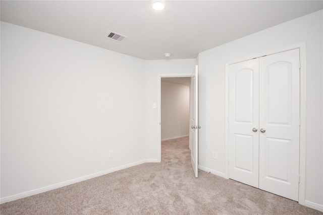 10699 Lost Maples Dr, Cleveland, TX 77328 - unfurnished bedroom featuring light colored carpet, a closet, and baseboards