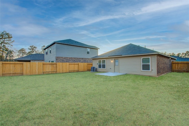 10699 Lost Maples Dr, Cleveland, TX 77328 - rear view of house with cooling unit and a patio area