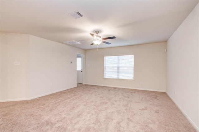 10699 Lost Maples Dr, Cleveland, TX 77328 - unfurnished room with a ceiling fan, light colored carpet, and baseboards