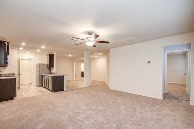 10699 Lost Maples Dr, Cleveland, TX 77328 - unfurnished living room with a ceiling fan, light carpet, attic access, recessed lighting, and baseboards