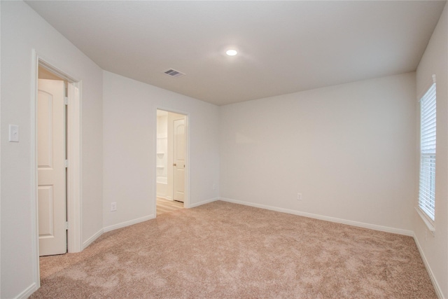 10699 Lost Maples Dr, Cleveland, TX 77328 - spare room with light carpet, baseboards, and recessed lighting