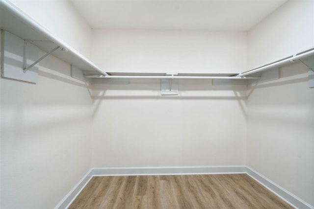 5847 Southington St, Houston, TX 77033 - walk in closet featuring wood finished floors