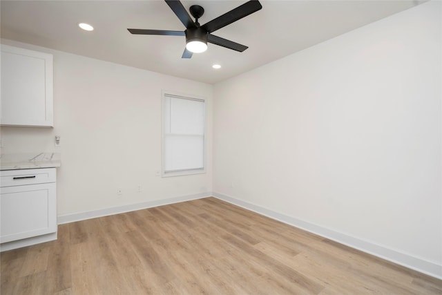 5847 Southington St, Houston, TX 77033 - unfurnished dining area with a ceiling fan, light wood finished floors, and recessed lighting