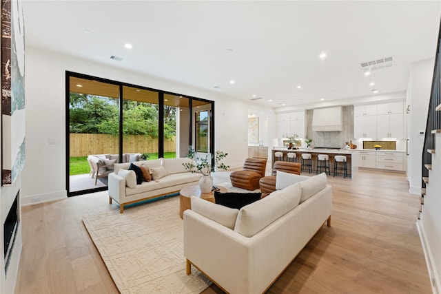 1741 Chippendale Rd, Houston, TX 77018 - living area featuring light wood-style floors and recessed lighting