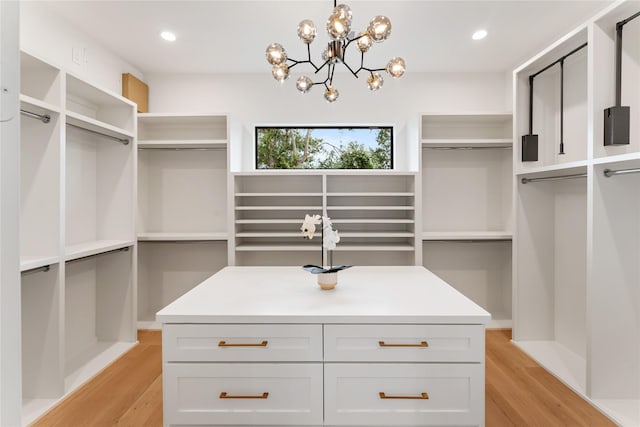 1741 Chippendale Rd, Houston, TX 77018 - walk in closet with light wood-style floors and a chandelier